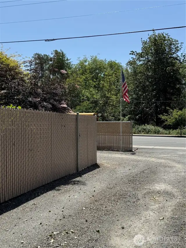 Looking from garage area down drivway....when looking to visit or view the home ...there is a ingress and egress making parking easy to enter and easy to exit . This property holds many cars for bar-bq moments and company or family parties etc..