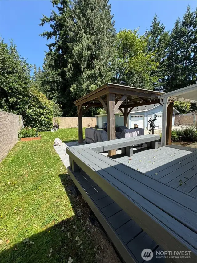 This sitting area and back deck is connected to the Master Bedroom....and leads to the back door in Kitchen   Waking up to all this outside privacy and landscaping.