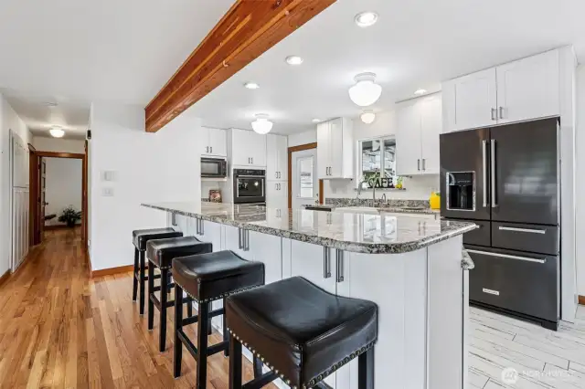 Top notch appliances, beautiful quartz countertops with room & plenty of cabinets for storage.