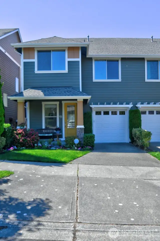 Attached single car garage; HOA mows/tends to the front yard.