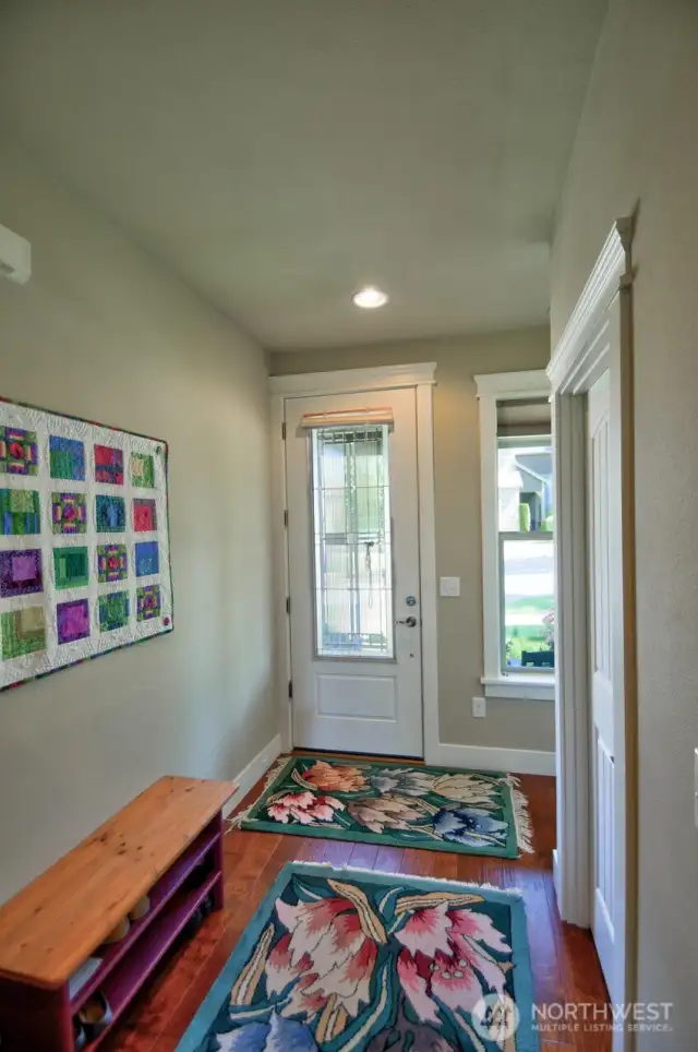 9' ceilings and elegant 3/4 lite glass door at entrance