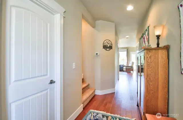 Engineered hardwood floors, white trim, panel doors, crown molding for a finished look.