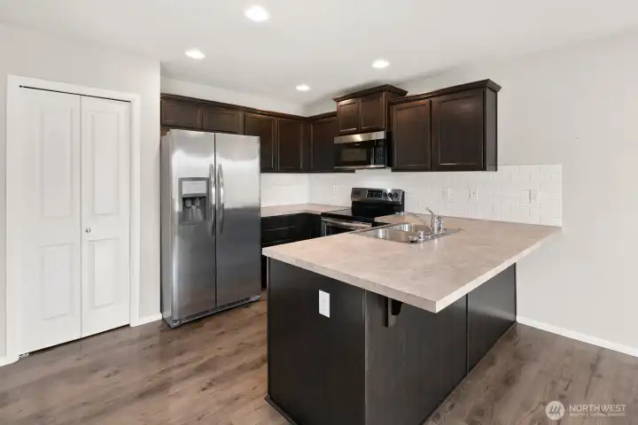 Pantry to the left of the refrigerator