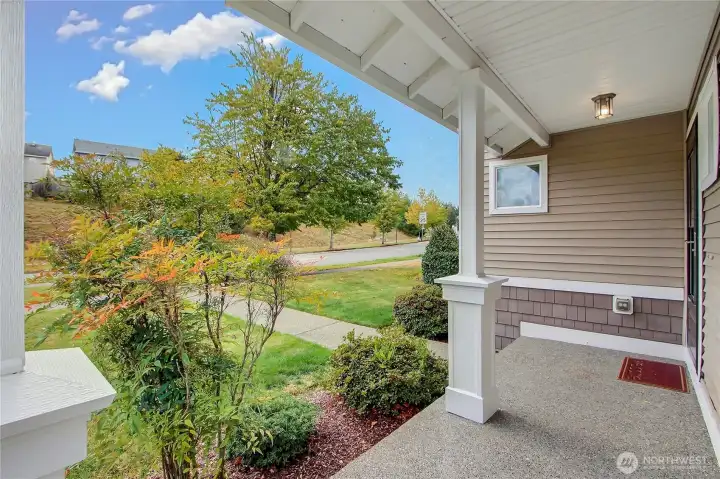 Inviting front porch with no homes directly across the street.