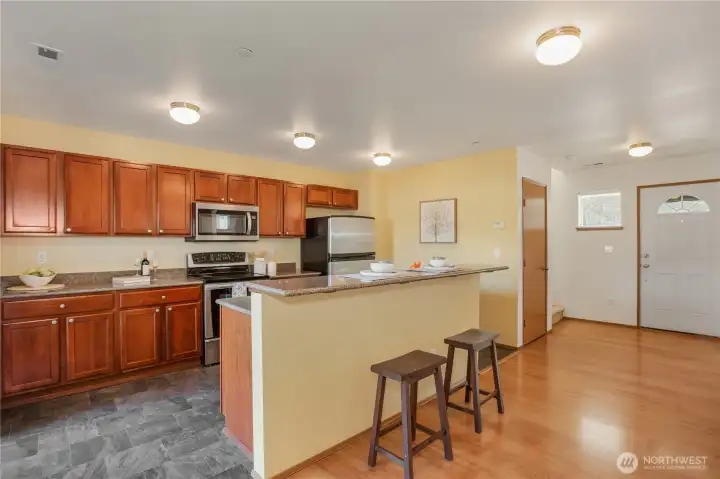 Kitchen with beautiful quartz counters.