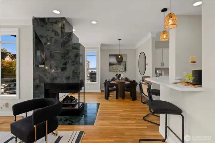 Gas fireplace anchors the space.
