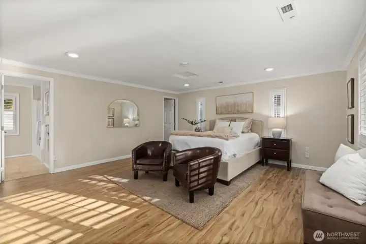 Primary room/bonus room featuring large ensuite bathroom and walk in closet