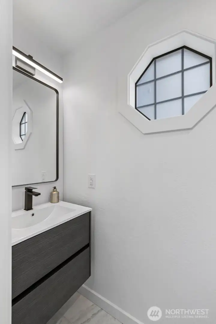 1/2 Bath on main finished with marble