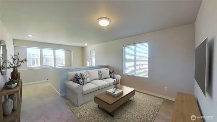 Upper-level loft area. Virtually staged.