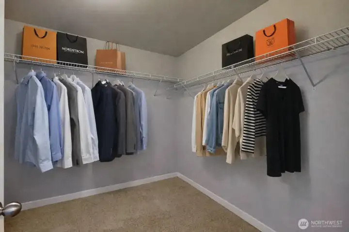 Primary closet. Virtually staged.