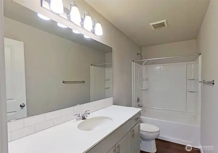 Upper-level full bathroom.