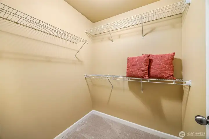 Walk-in closet located off the primary bath