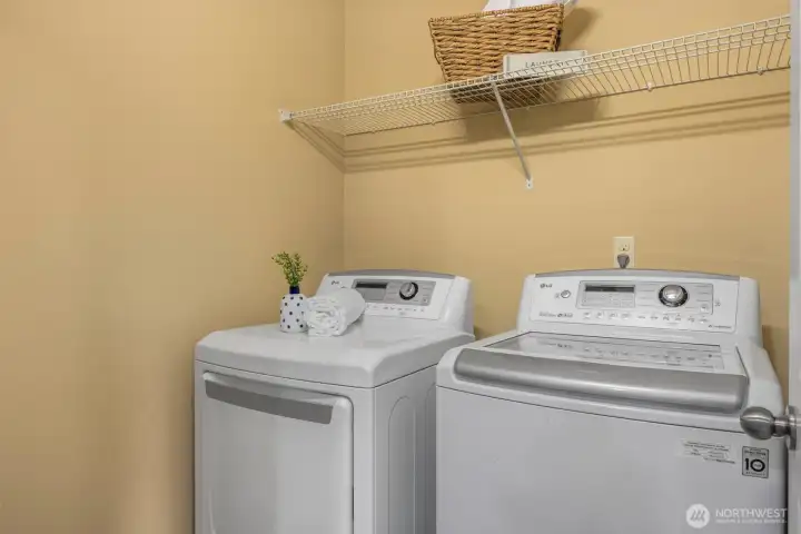 Laundry room conveniently located on upper floor between bedrooms
