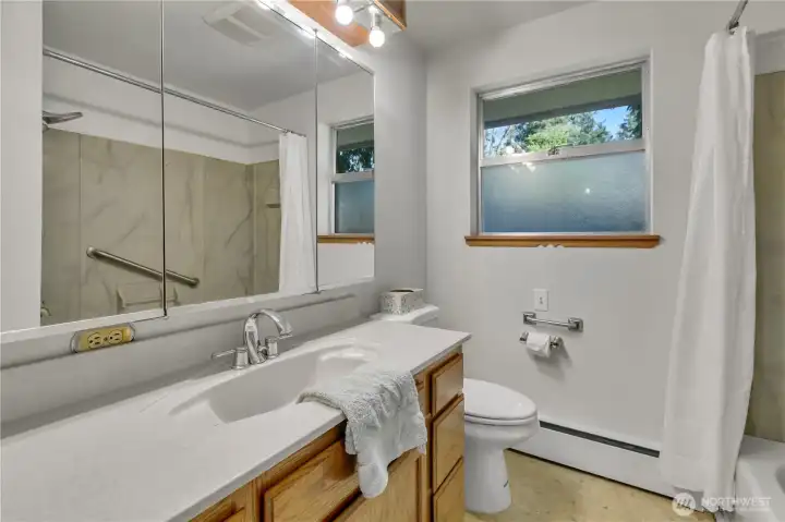 The full main bathroom has been remodeled in the past and has much storage.