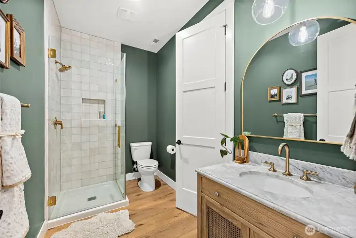 Main floor bath is gorgeous, 10’ ceilings.