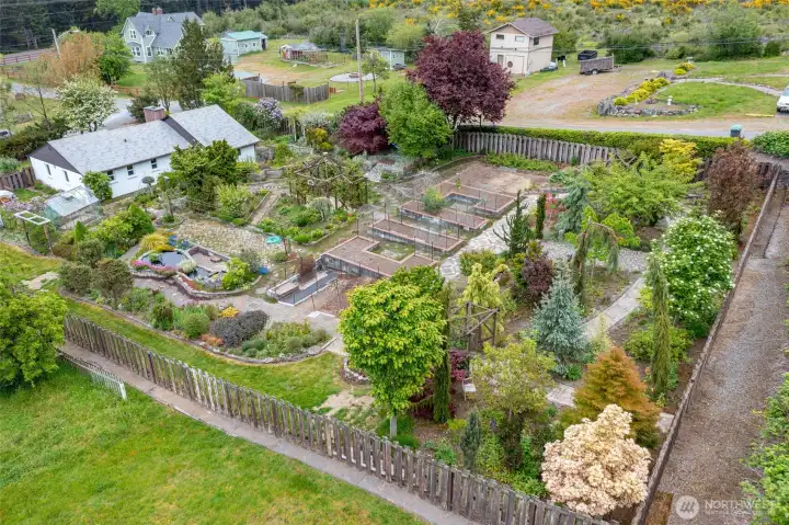 Rear yard is fully fenced with several gates for access