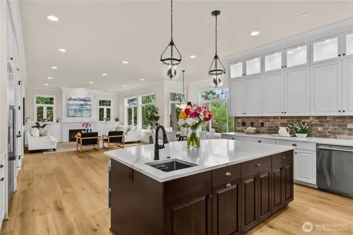 Custom cabinetry, and expansive island ideal for entertaining Custom cabinetry, and expansive island ideal for entertaining