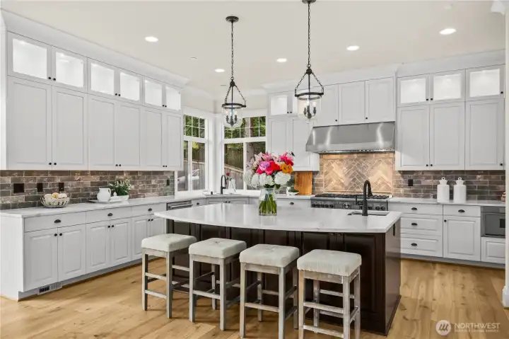 Custom cabinetry, and expansive island ideal for entertaining Custom cabinetry, and expansive island ideal for entertaining