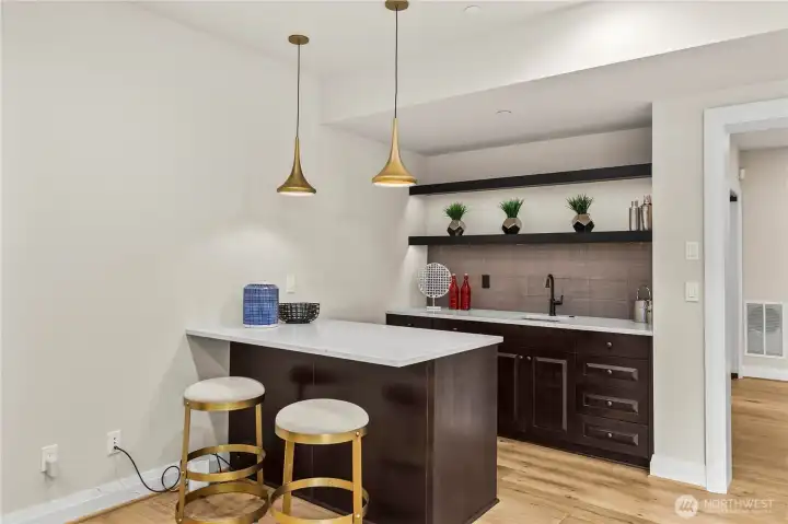 Lower-level wet bar ideal for gatherings Lower-level wet bar ideal for gatherings
