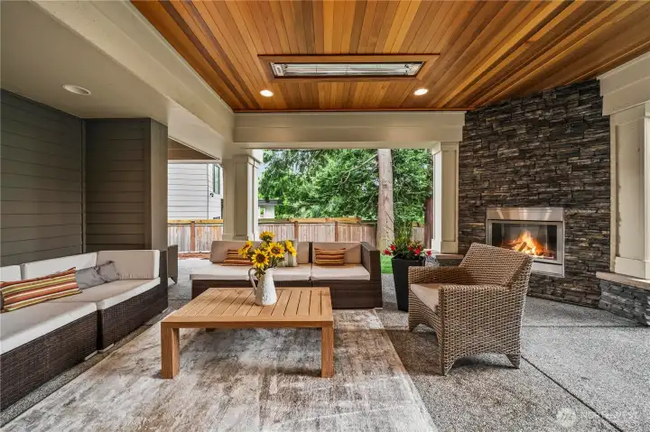 Covered outdoor patio with fireplace and built-in heaters for year-round enjoyment Covered outdoor patio with fireplace and built-in heaters for year-round enjoyment