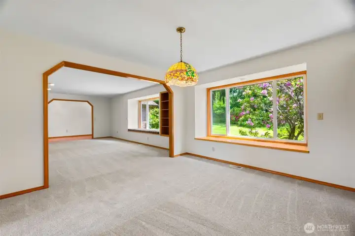 The dining area and living room feature New paint and carpet.Wonderful woodwork throughout the home.