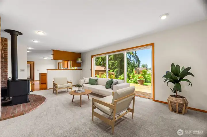 This is the family room off of the kitchen with its triple slider looking over the deck and the upper property.
