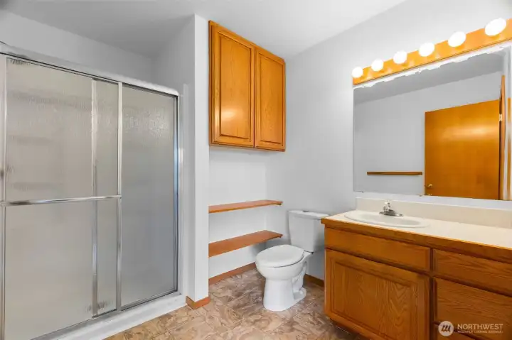 The bathroom off of the primary bedroom with new step in shower.