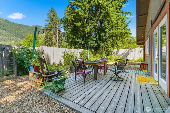 Deck in back of garage is fully fenced & offers garden space & views of Ranger Ridge.