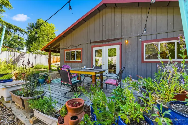 Back deck. French doors to flexible living space behind garage.