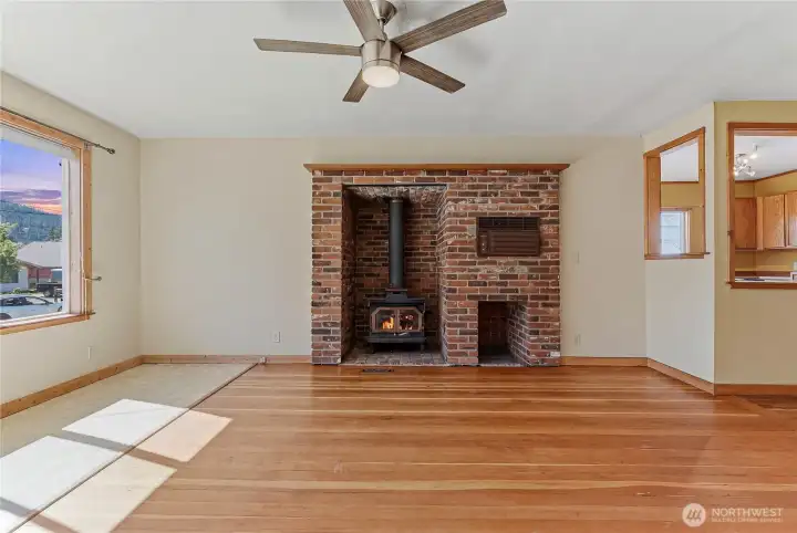 Brick wood stove hearth warms the front room in winter months.