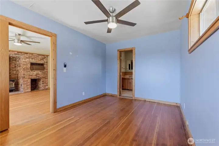 Primary bedroom suite is locate just off the living room.