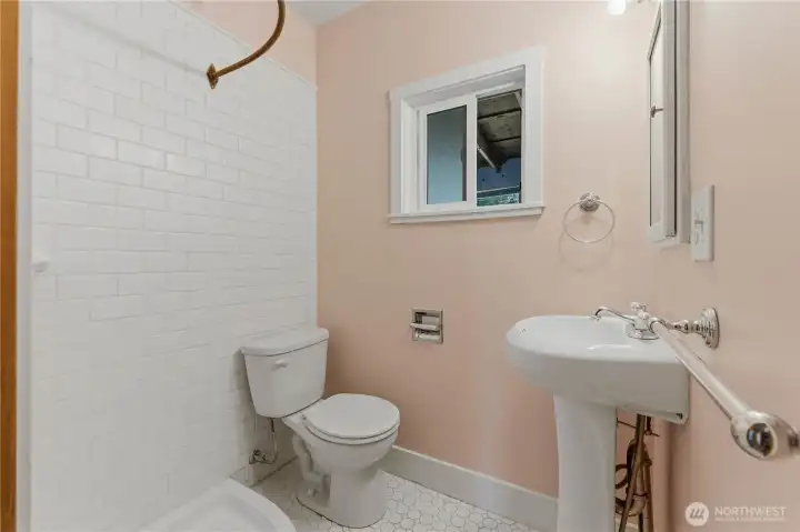 Shared 3/4 bathroom for guests & conveniently located between the 2nd & 3rd bedroom.