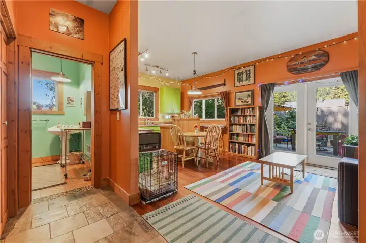 Rear flexible space behind garage has a full bath & lots of room for an additional living room, rec room, guests, etc.