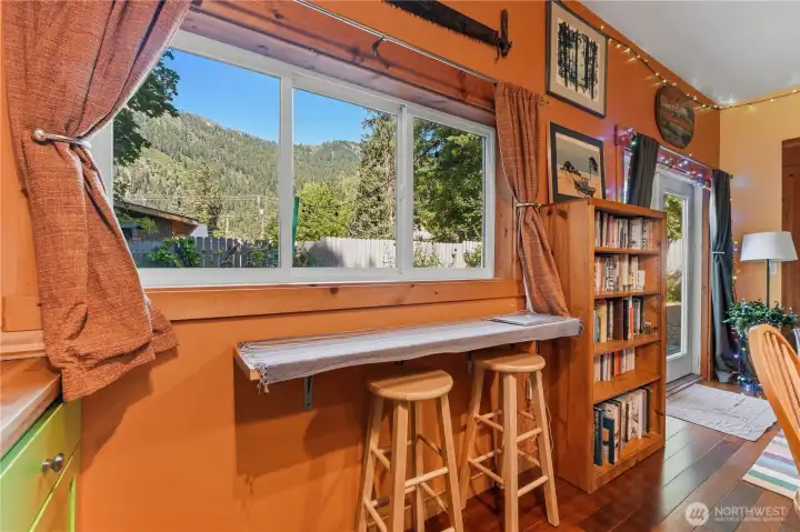 Barstool seating with views of Ranger Ridge in the rear flex space.