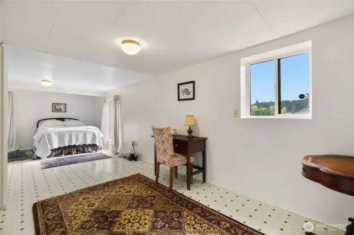 Lower level bedroom has natural light and a fresh coat of paint.
