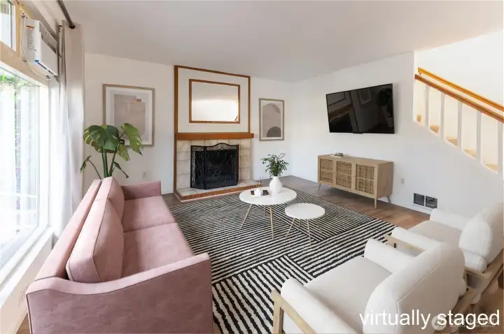 Large and inviting living room with huge windows & fireplace Large and inviting living room with huge windows & fireplace