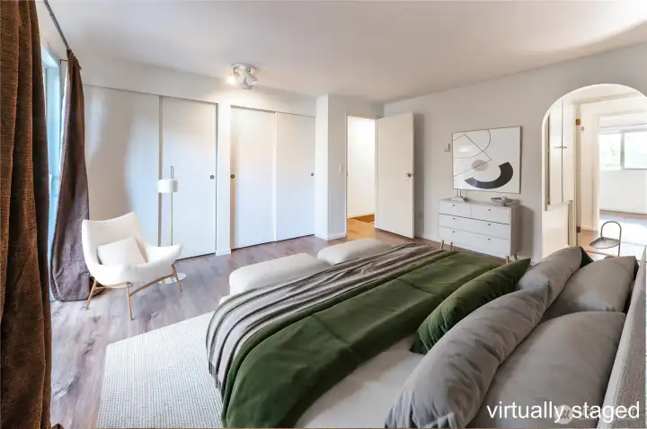 The primary bedroom is spacious, wall of closets and balcony to enjoy. The primary bedroom is spacious, wall of closets and balcony to enjoy.