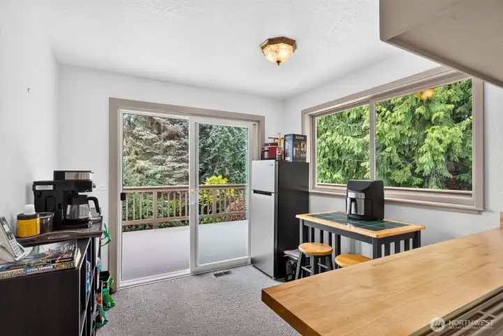 Breakfast nook off kitchen w/ slider access to upper deck Breakfast nook off kitchen w/ slider access to upper deck