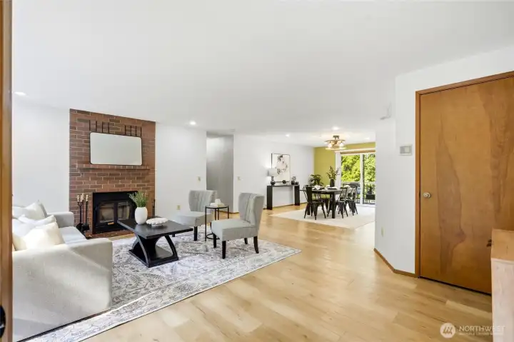 Entry into living room flows into dining and kitchen. Entry into living room flows into dining and kitchen.