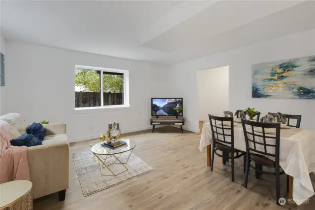 This is a nice sized space and easily has both living room and dining furniture.  You can also see the second entrance leading directly into the living space