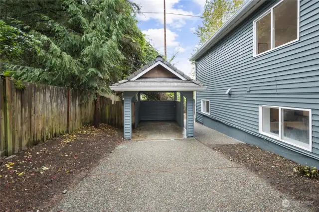 Here is the carport, located behind a gated entrance for privacy and security.