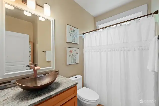 Full bathroom on the main level, adjacent to main level bedroom. Fixtures, sink and granite countertop installed in 2018