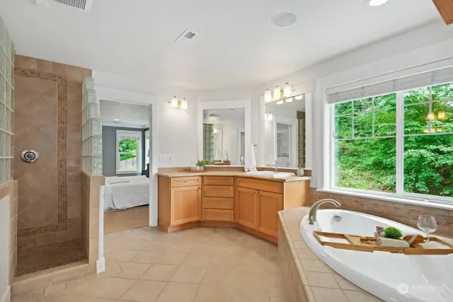 Primary bathroom with dual sinks, soaking tub and luxurious shower.