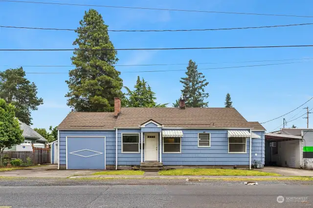 House (3BR 2BA) on one side, shop on the side of this corner lot in heart of Puyallup!