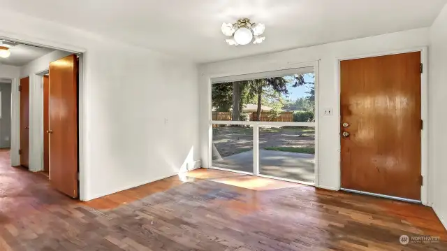 Dining room area with door leading to the large patio and fully fenced yard with out buildings.