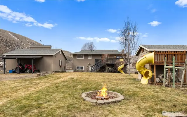 Firepit, horseshoe pit, and play house!