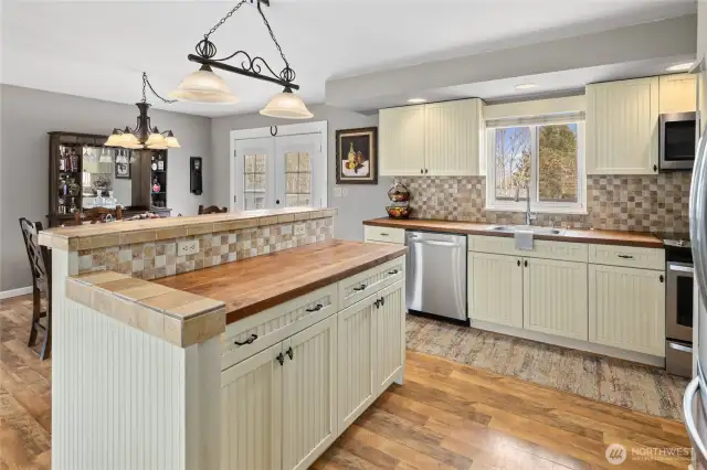 Butcher block countertops throughout kitchen.