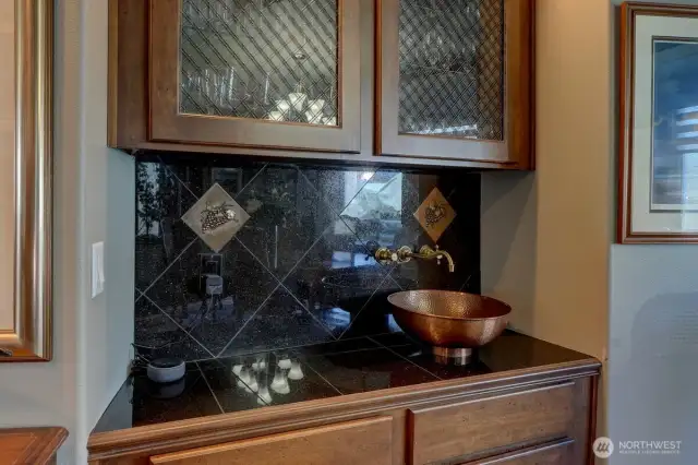 Wet bar outside wine room.