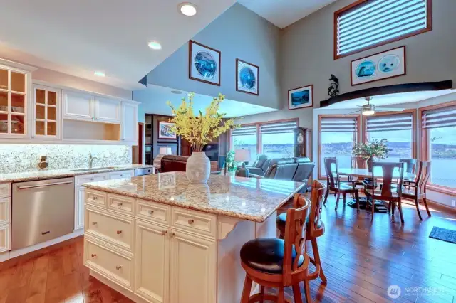 Spacious kitchen off den enjoys water & mountain views while you prepare meals.  .