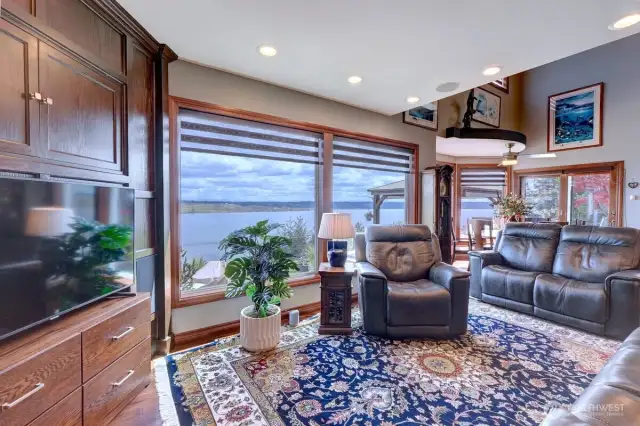 A wall of windows continues in the family room.